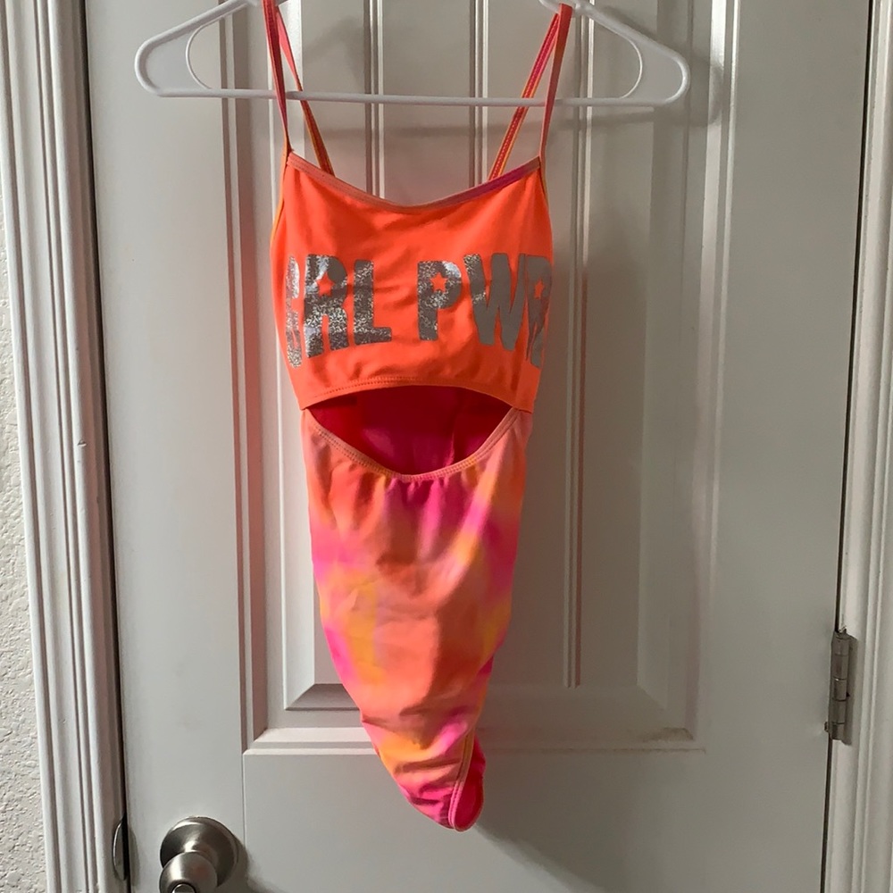 One piece bathing suit with open stomach area